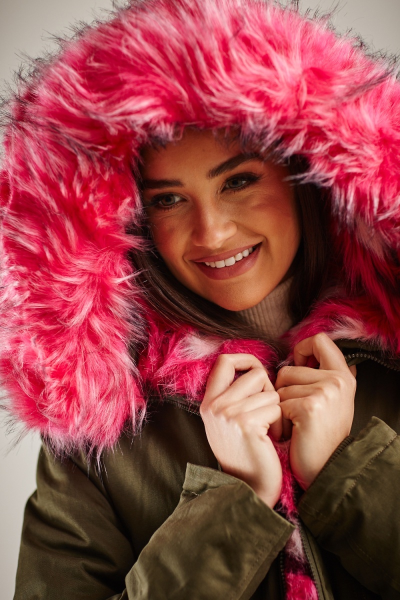 green coat with pink fur hood