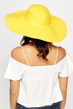 wide brimmed yellow hat