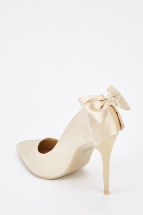 white heels with bow on back