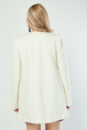 cream collarless coat