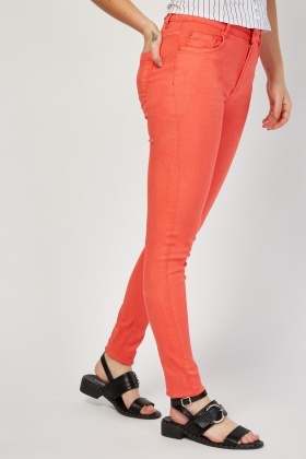 coral skinny jeans