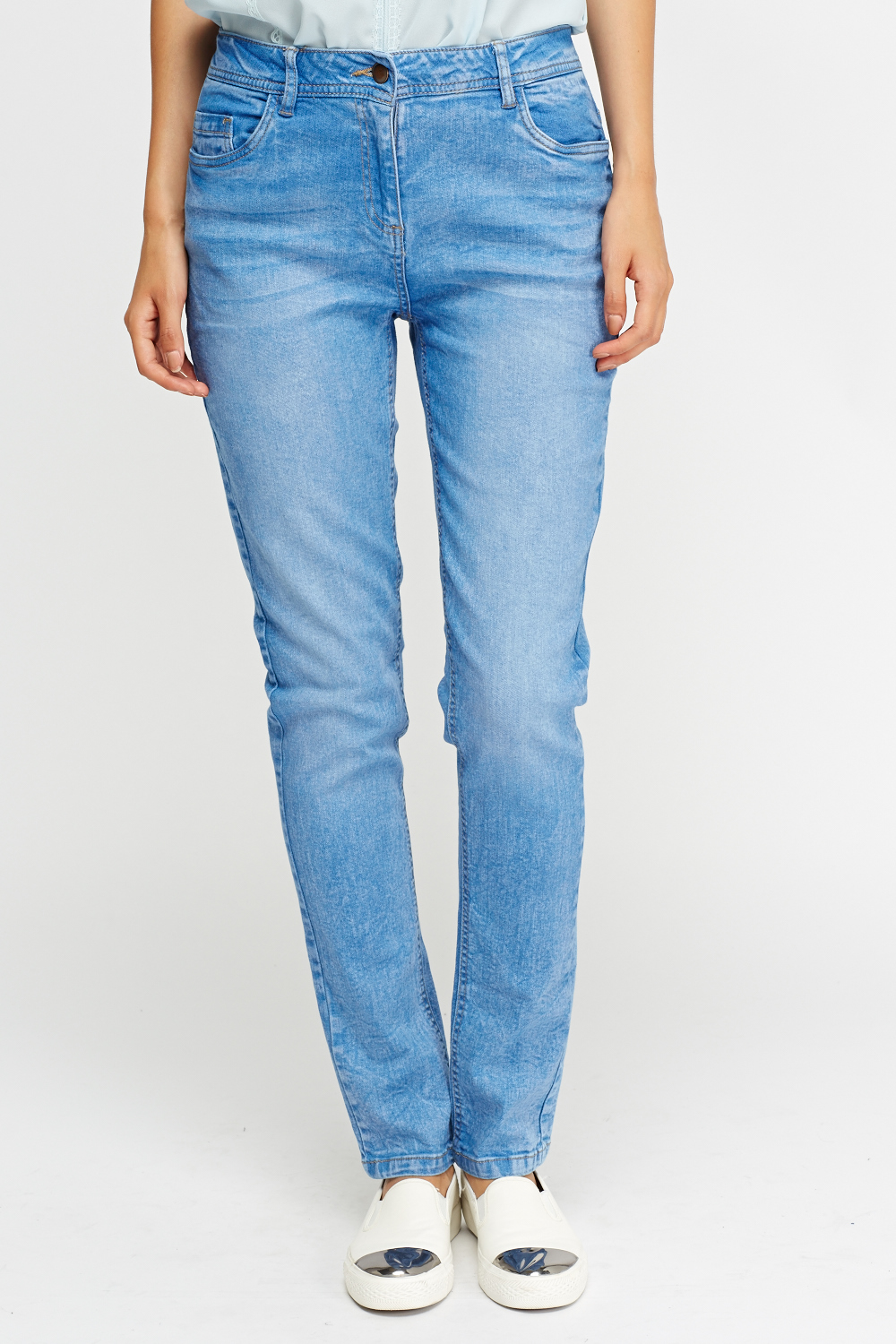 stacked light blue jeans